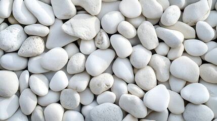 White pebbles, flat surface, top view

