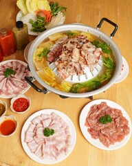 Fresh Ingredients in Hot Pot with Sliced Meat and Vegetables Setup