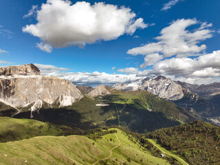 Beautiful Dolomite mountain Alps dawn aerial view range against blue sky on sunny day Italy. Top...