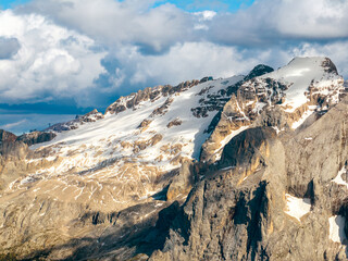 Aerial view beautiful Dolomite mountain Alps dawn range against blue sky on sunny day Italy. Top...
