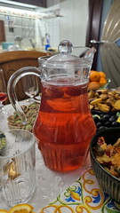 Compote in a glass jug on a festive table