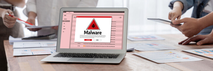 Cyber attacking concept. Malware alert showing on computer screen display scam and threat detection...