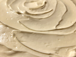 Close-up of vanilla cream background, white beige cream texture