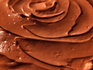 Close-up of chocolate cream background, brown chocolate cream texture