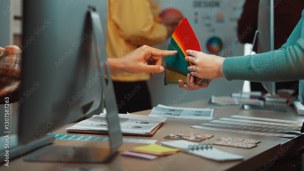 Poster engaging scene in a design studio showing hands selecting a vibrant color palette. this collaborativ