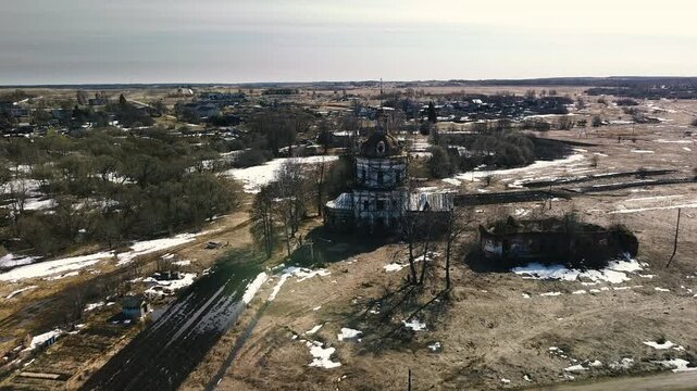 A ruined old stone church in an early spring landscape