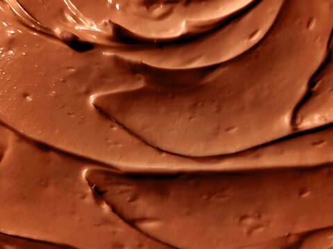 Close-up of chocolate cream background, brown chocolate cream texture for food design and background