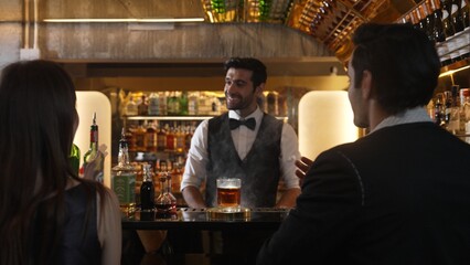 Smart bartender opening mist of whiskey mixed smokey cocktail glass making special drink list presentation for advertisement in focusing alcohol refreshing showcase at luxurious counter bar. Vinosity.