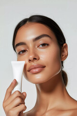 Skincare cosmetic beauty mock up, beautiful woman with hydrated skin face holding moisturizing product