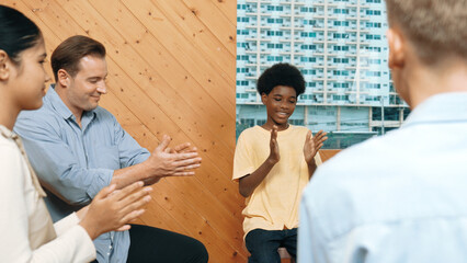 Multicultural people clapping hands to encourage in group therapy. Happy diverse student clap hand...