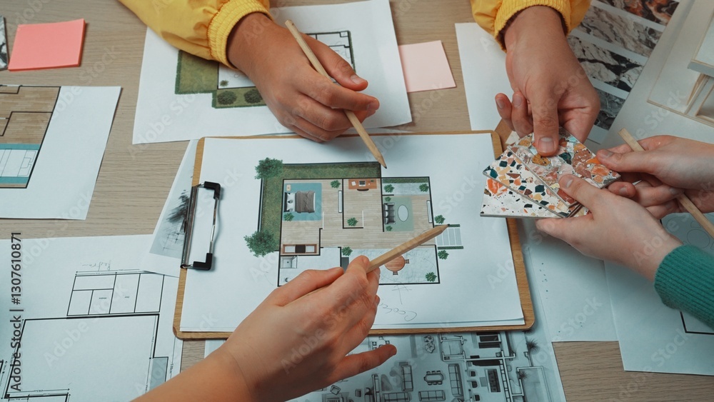 Poster teams brainstorm and share ideas in a collaborative workspace while reviewing design plans and color