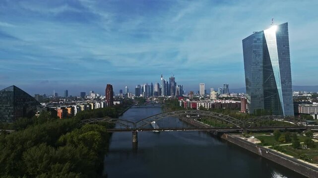 An aerial drone view of the Deutschherrnbr&uuml;cke in Frankfurt, Germany, showcasing the steel railway bridge that spans the River Main and connects the eastern part of the city with the Sachsenhausen dis