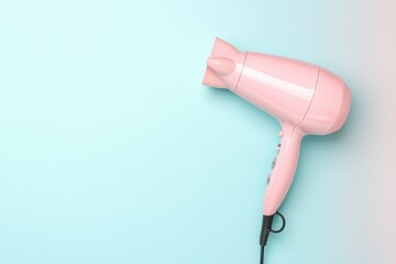 Fototapeta premium Elegant Pink Hair Dryer Against Soft Blue Background in Minimalist Bathroom Setting