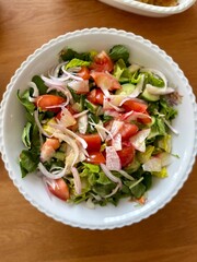 Fresh green onion salad with leaves and vegetables.
