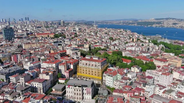 Istanbul, Turkey: Aerial view of famous Turkish city straddling Bosphorus Strait, summer day with clear blue sky - landscape panorama of Europe / Asia from above
