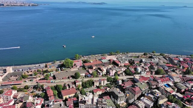 Istanbul, Turkey: Aerial view of famous Turkish city straddling Bosphorus Strait, summer day with clear blue sky - landscape panorama of Europe / Asia from above
