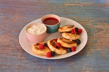 A plate of pastries with a blue background