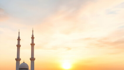 Majestic mosque minarets silhouetted against a vibrant sunset sky. Peaceful scene ideal for religious or travel publications