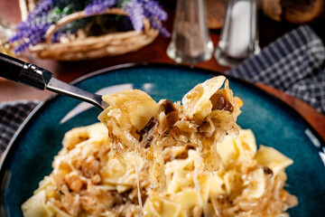 Pasta with sauerkraut and mushrooms.