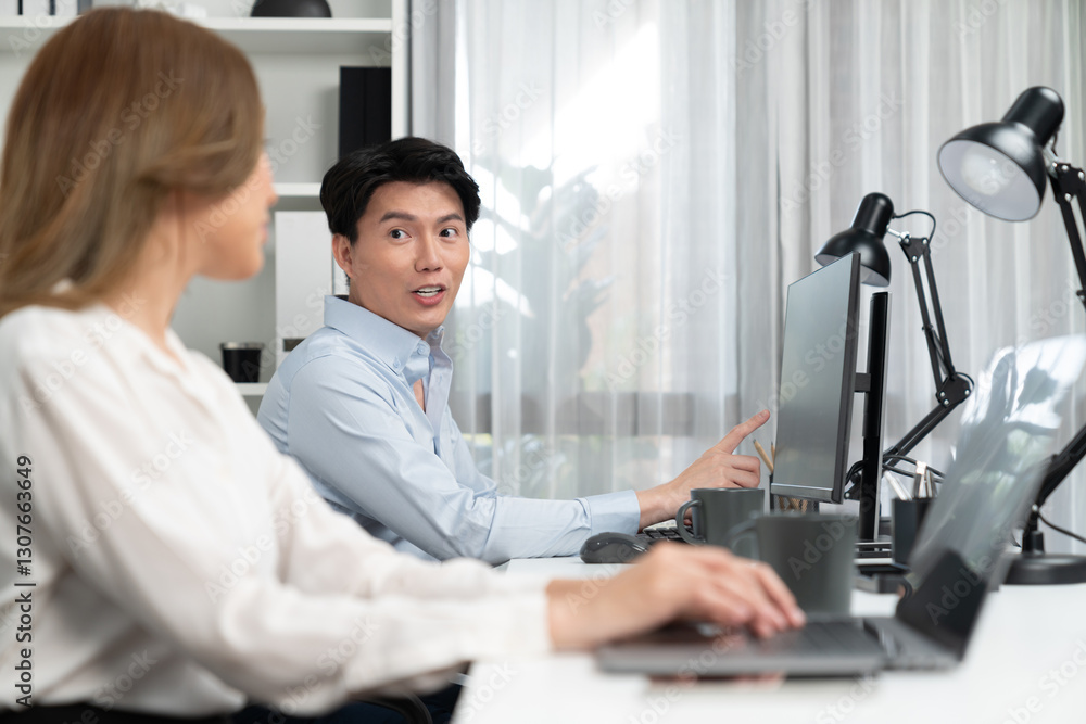 Poster smiling asian man talking with woman colleague in planning marketing report project on laptop casual