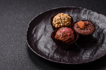 Homemade chocolate candies with different fillings and sprinkles