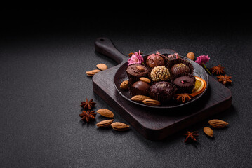 Homemade chocolate candies with different fillings and sprinkles