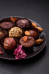 Homemade chocolate candies with different fillings and sprinkles