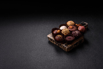 Homemade chocolate candies with different fillings and sprinkles