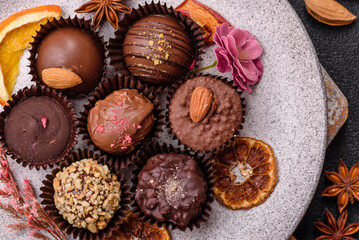 Homemade chocolate candies with different fillings and sprinkles