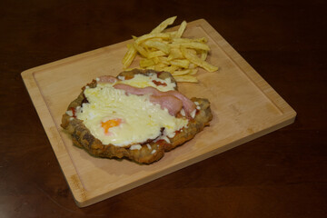 A plate of food with a piece of bacon and cheese on top of it