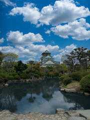  Osaka Castle Reflected in Serene Garden Pond