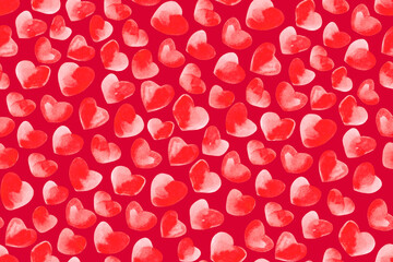 Abstract red background. Seamless pattern of watercolor red hearts.