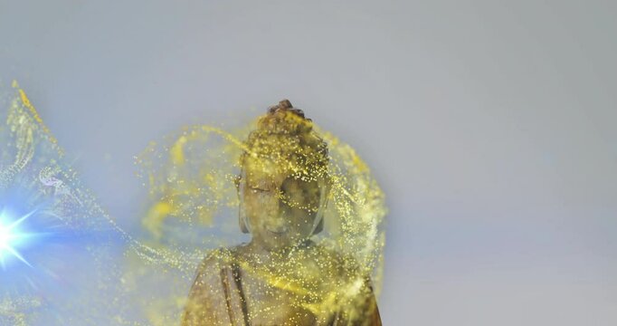 Swirling golden particles and blue light surrounding Buddha statue in animation