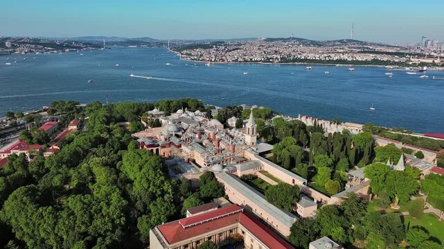 Istanbul, Turkey: Aerial view of largest Turkish city, famous historic landmark and museum Topkapi Palace (Topkapı Sarayı), sunny summer day - landscape panorama of Europe / Asia from above

