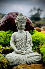 Obraz premium Buddha’s Serenity: Meditation by a Waterfall