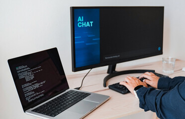 Fototapeta premium AI chat bot, Programmer using generative artificial intelligence for software development inside office. Virtual chatBot technology trend