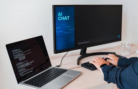 AI chat bot, Programmer using generative artificial intelligence for software development inside office. Virtual chatBot technology trend