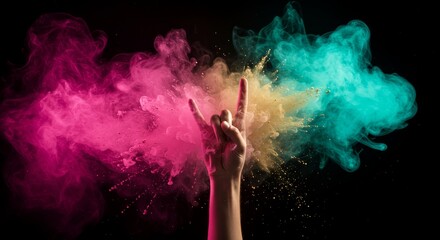 Hand Gesture in Colorful Smoke Explosion - A hand making a rock and roll sign emerges from a vibrant explosion of pink, teal, and gold smoke against a black background