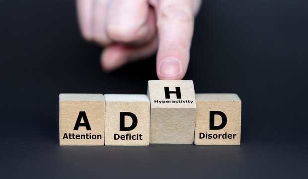 Hand turns cube and changes the acronym ADD (Attention Deficit Disorder) to ADHD (Attention Deficit Hyperactivity Disorder)