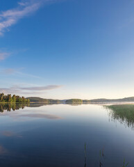 Calm lake with a blue sky in the background