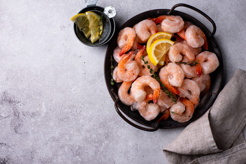 Frozen uncooked prawns or shrimps with lemon