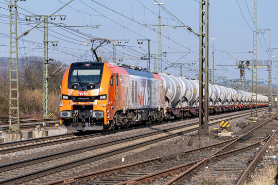 N&ouml;rten-Hardenberg, Germany - February 20, 2025: hvle Stadler Eurodual electro-diesel locomotive with innofreight surface water wagons