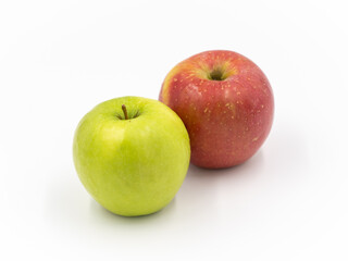 Two Apples that are Red and Green Isolated Against a White Backround