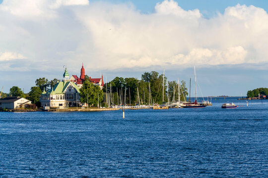 Ships and pier on the Valkosaari island, Helsinki, Finland, sunny summer day