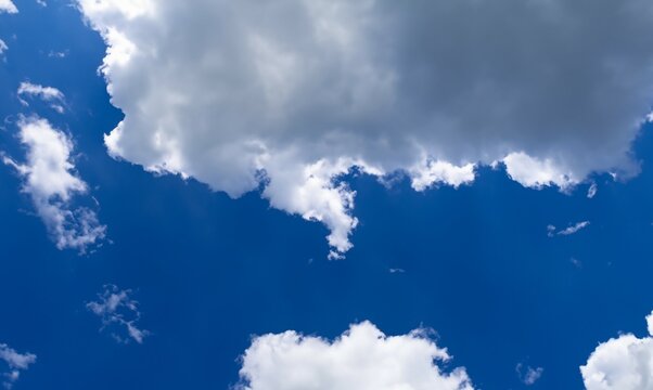 Cumulus humilis clouds in blue sky, view from below. Cumulus humilis developing into fractus under. Empty cloudy blue sky. Copy space.
