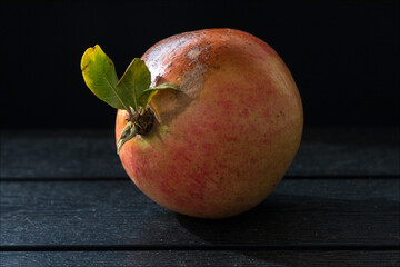 pomegranate on a wooden table
