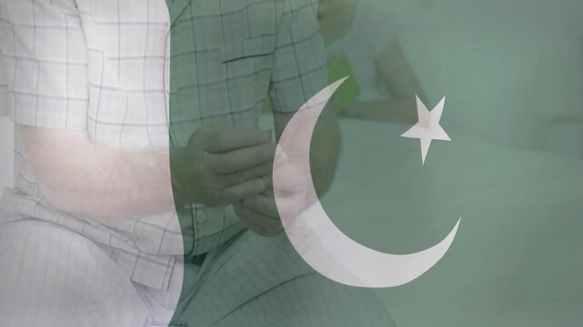Holding object in hands, person with Pakistani flag overlay in animation