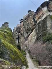 a monastery on a cliff in meteora, greece