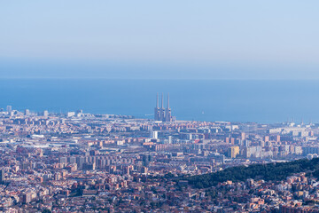 Naklejka premium Barcelona, ​​Spain - February 3, 2025: Aerial view of the city. Cityscape from above the Temple of the Sacred Heart, Tibidabo