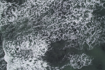 Aerial, Winter’s crashing tidal waves at Down Derry in Cornwall UK